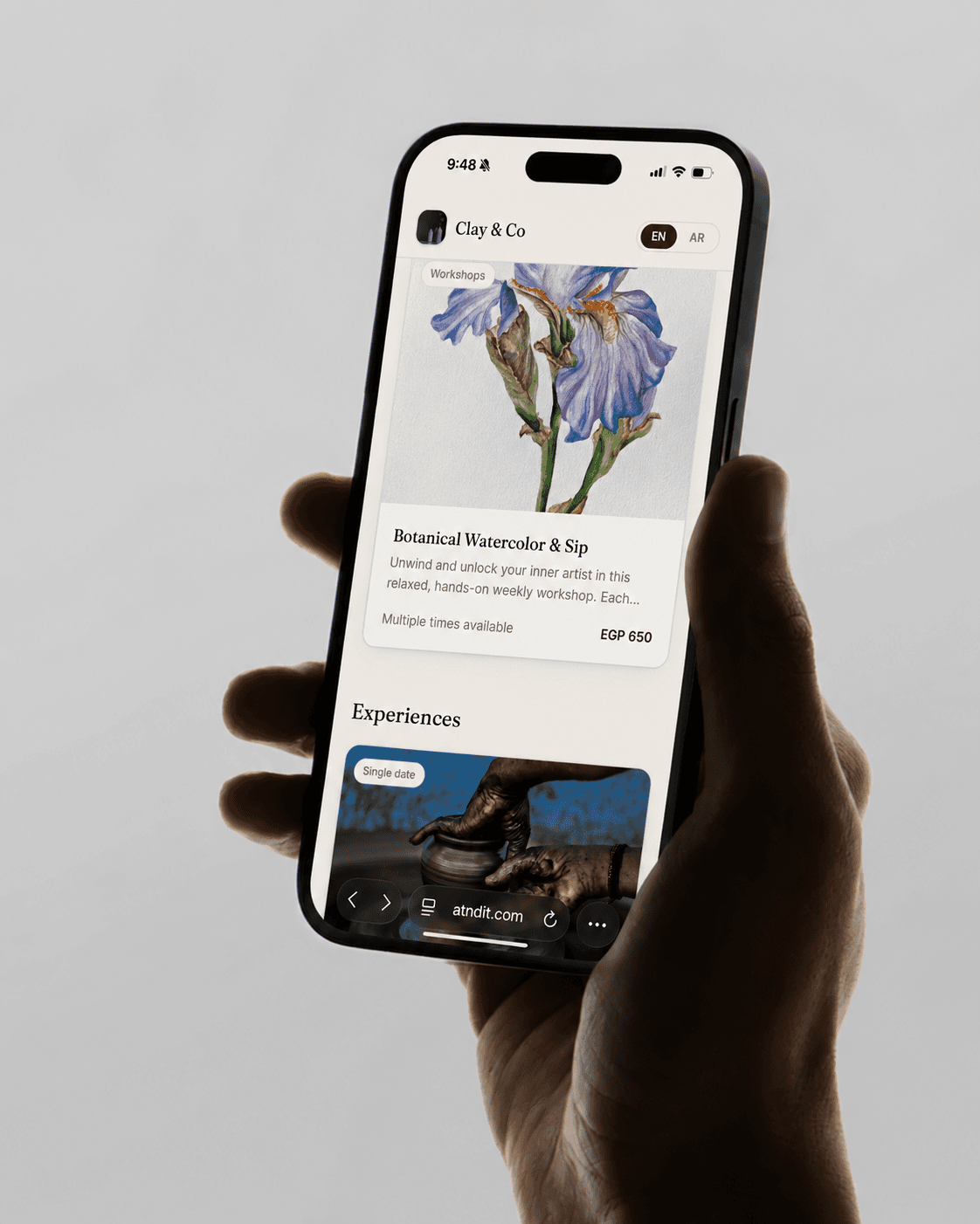 The atndit storefront open on a phone — a host's branded booking page.